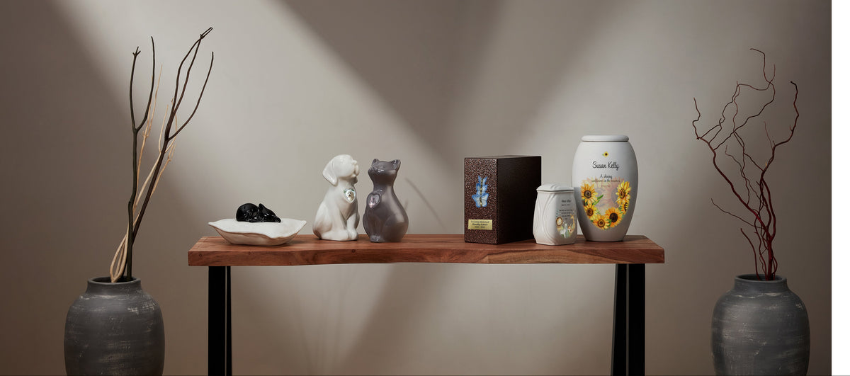 Different kinds of cremation urns for cats and humans. Cremation urns are personalized with images and text.